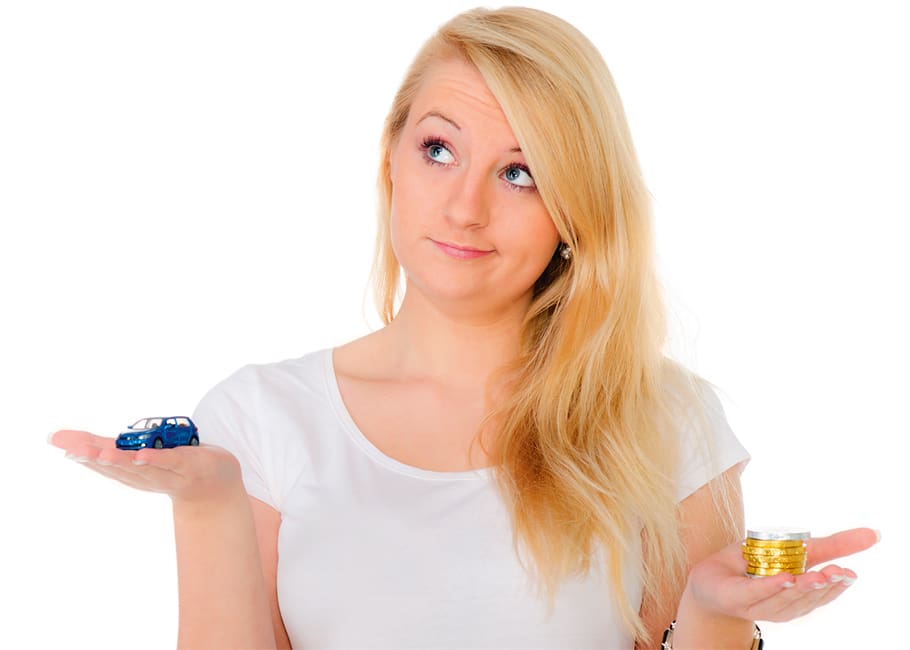 a person holding a toy car and gold coins