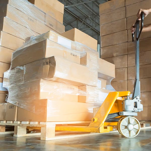 Stack of cardbard boxes on pallet in distribution warehouse