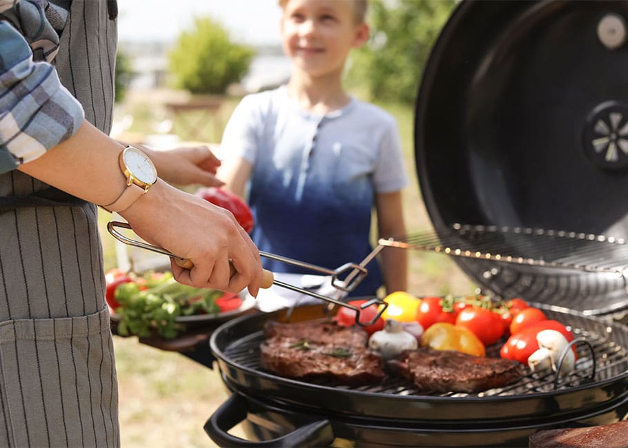 people using a grill