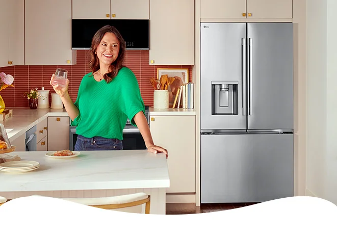 Woman in kitchen with fridge