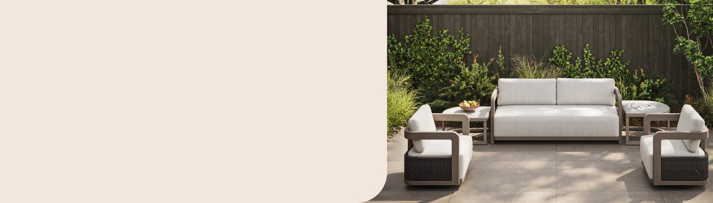 Modern Agio patio set with a cream sofa, two swivel chairs, and side ...