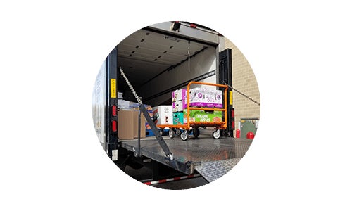 Costco charitable community donations being loaded onto truck for giving