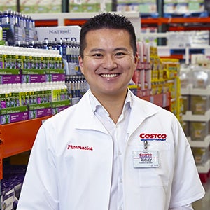 Costco employee in Pharmacist jacket at warehouse