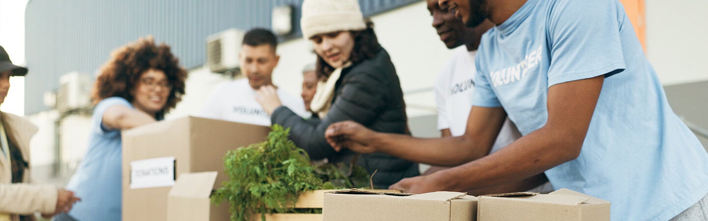 Volunteers managing a donations table at a community event
