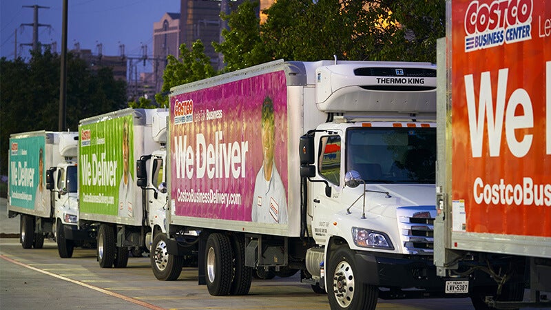 Line of Costco delivery trucks - transportation and logistics