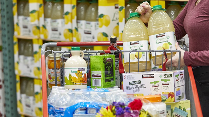 Costco cart filled with Kirkland Signature products