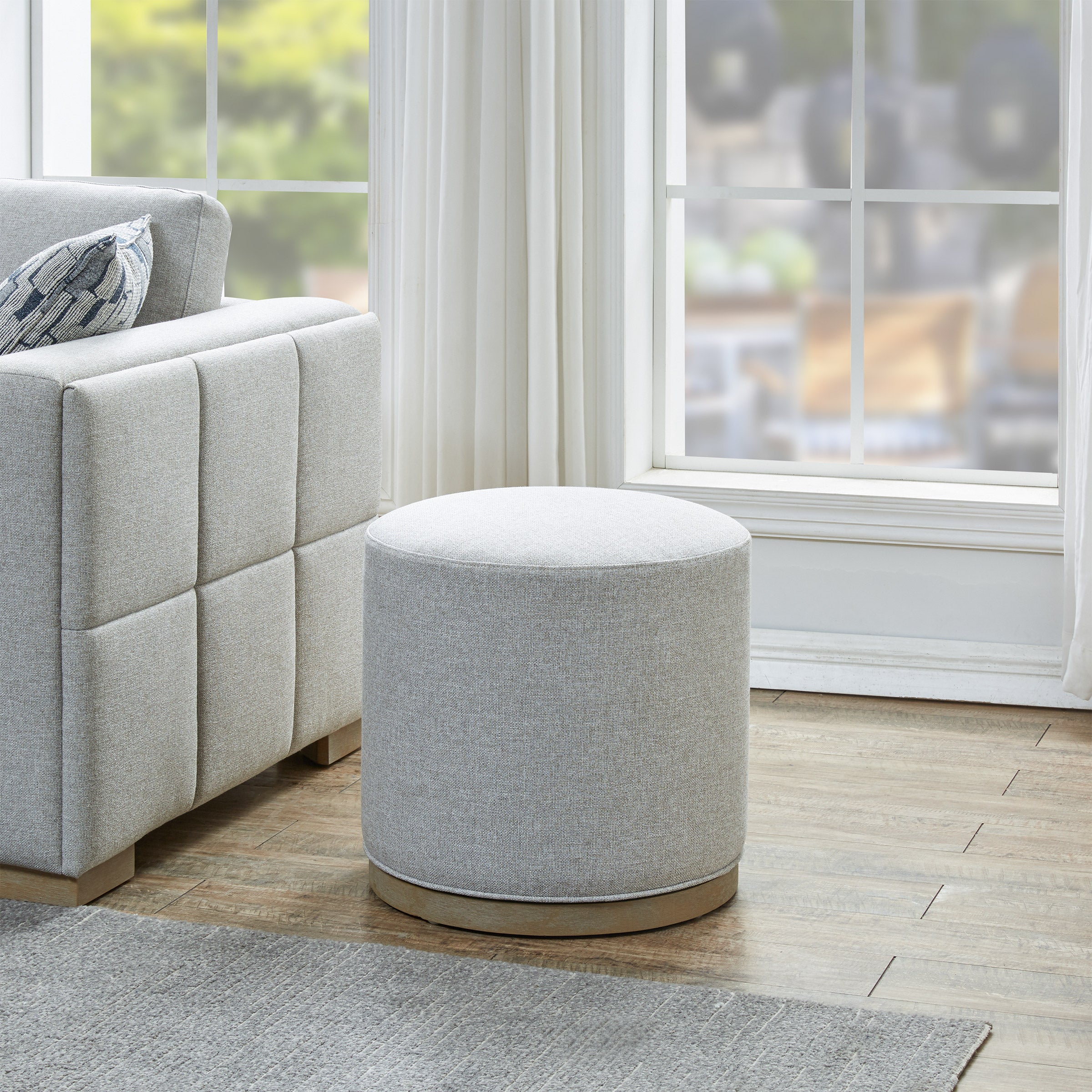 Drayden Fabric Swivel Ottoman | Costco